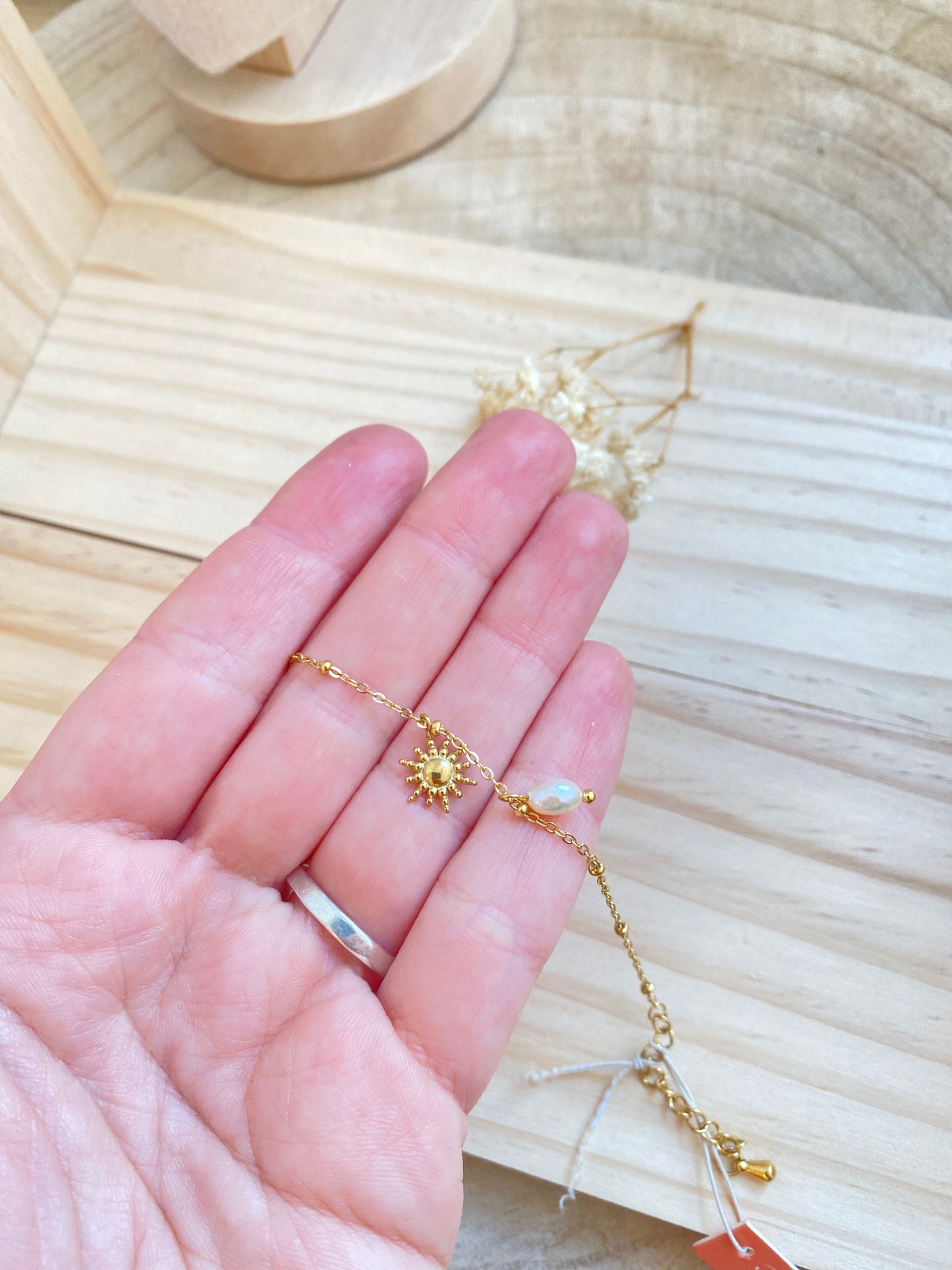 Sonne mit Perle Gold