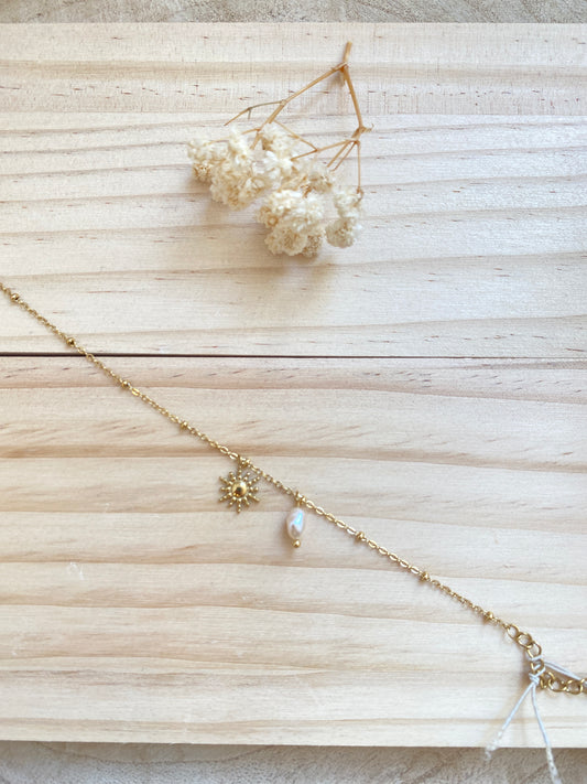 Sonne mit Perle Gold