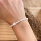 Armband elast. weiße Perlen